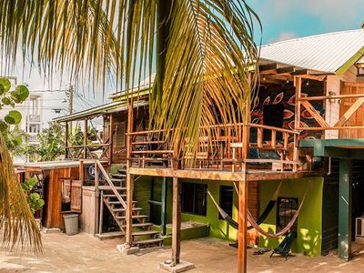 two story wooden building with patio