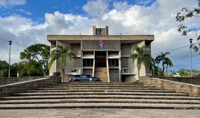 court house with government vehicle in front and stairs