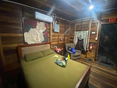 room with bed and air conditioning