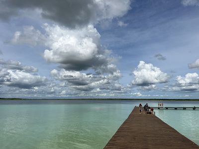 boardwalk over colorful lagoon