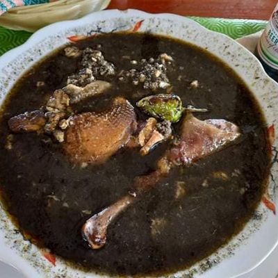 black soup with meat and pepper