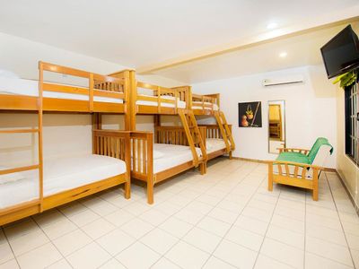 room with bunk beds and television