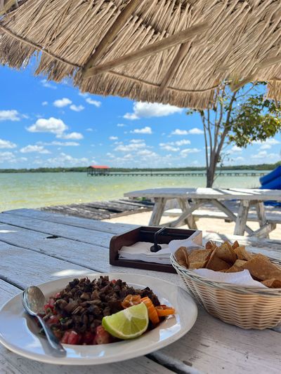 meat ceviche under palapa with lagoon view