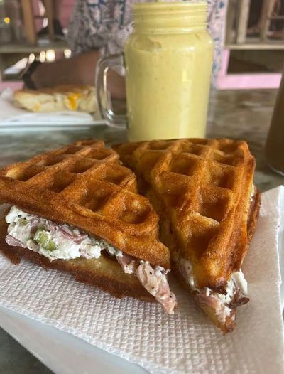 waffle with filling and smoothie behind it