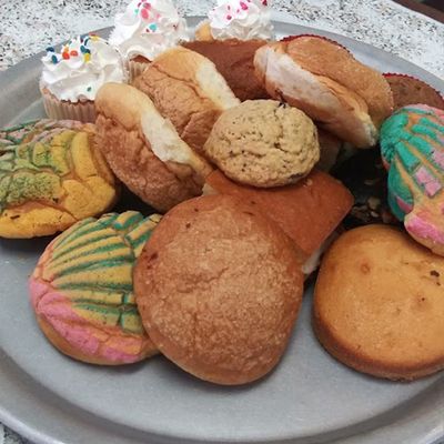 variety of sweet bread on metal tray