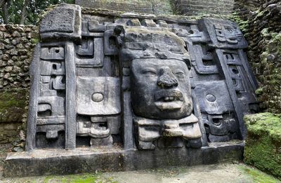 mayan temple with carved fact