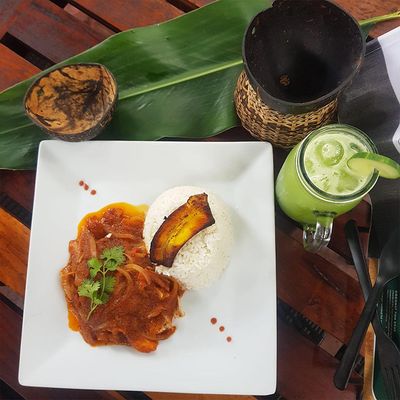 butter garlic fish with leaf and coconut as props