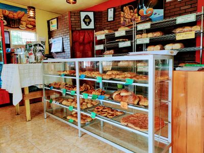 local bread displayed in wood shelf