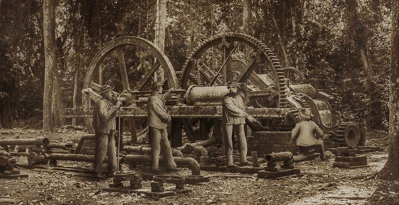 aged sugar mill with workers