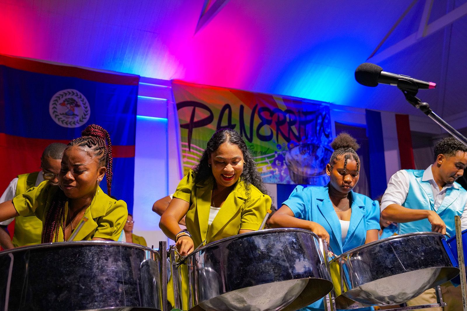 young people playing steel pan on stage