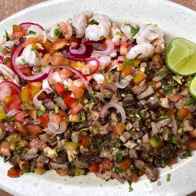 meat in ceviche mix with shrimp and lime