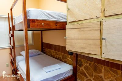 room with bunk bed and lockers